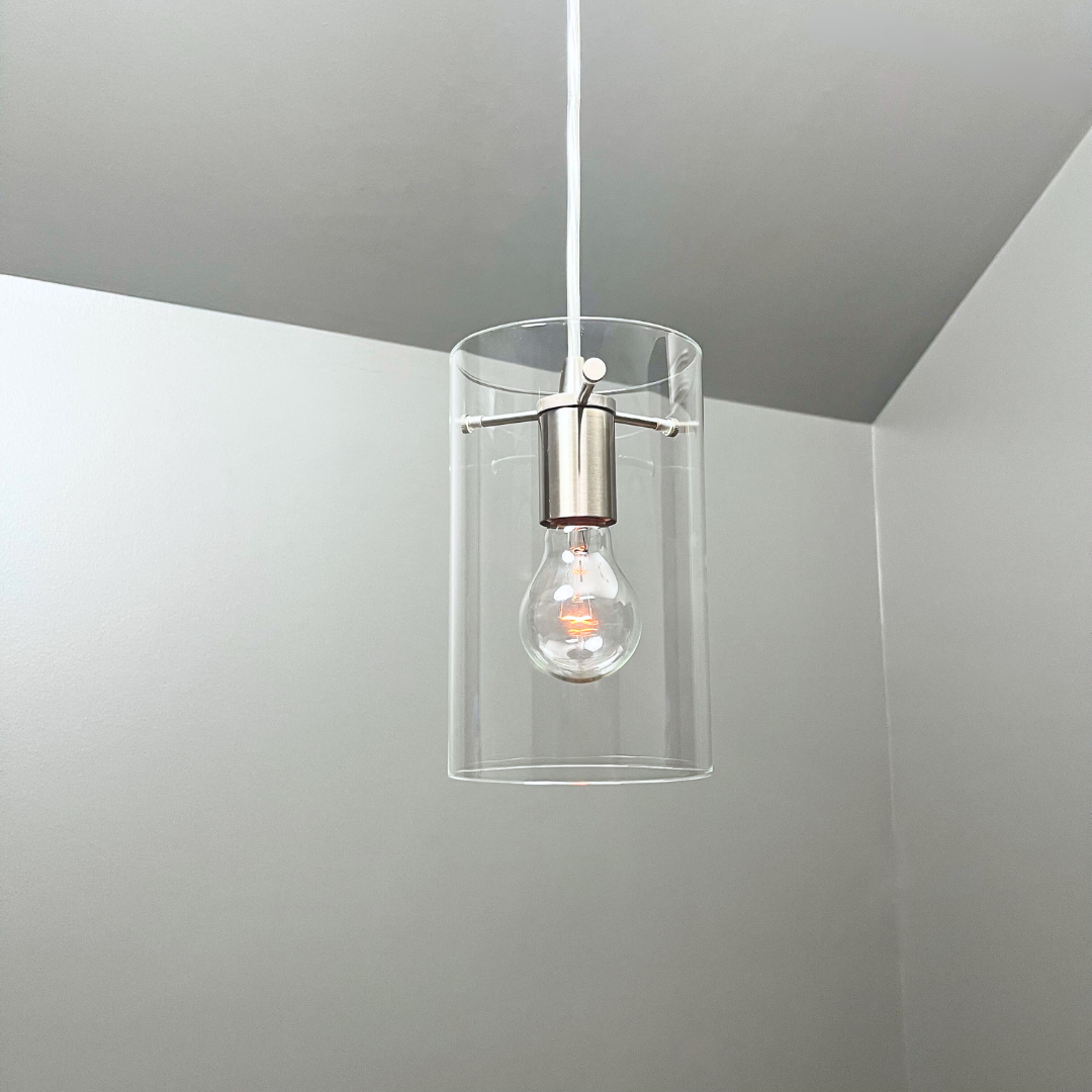 Lifestyle photo of Brushed Nickel Cylinder Glass Shade Instant Pendant Light in the ceiling