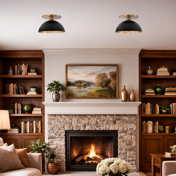 Satin Brass Flush Mount Light with Matte Black and Gold Dome in a living room
