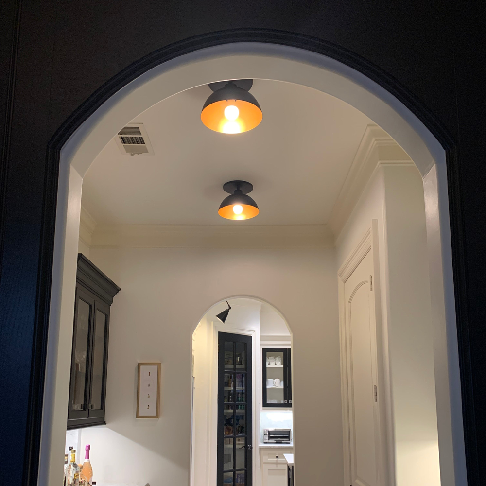 Matte Black & Gold Dome Instant Flush Mount Recessed Conversion Kit installed in a hallway
