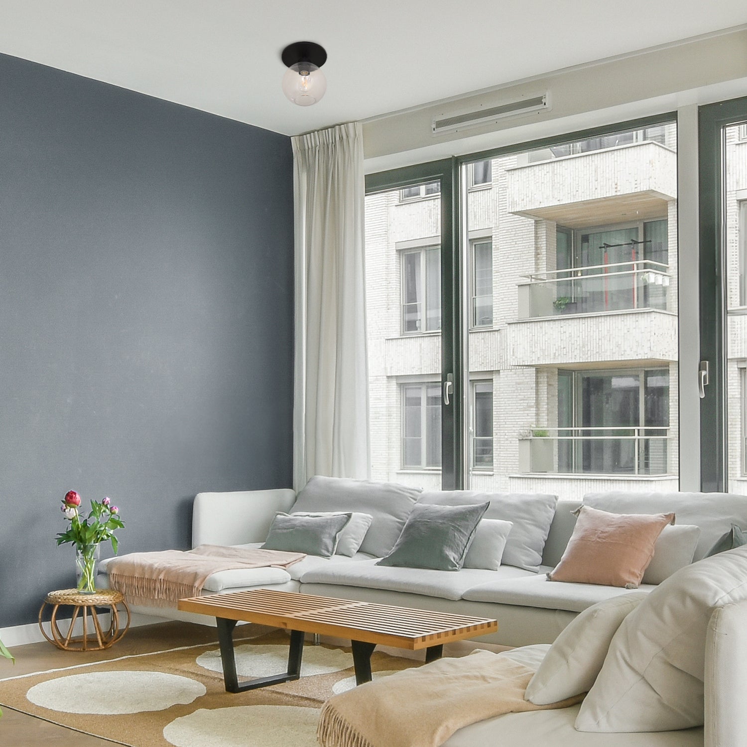 Matte Black Clear Globe Instant Semi Flush 6" Recessed Conversion Kit installed in a living room