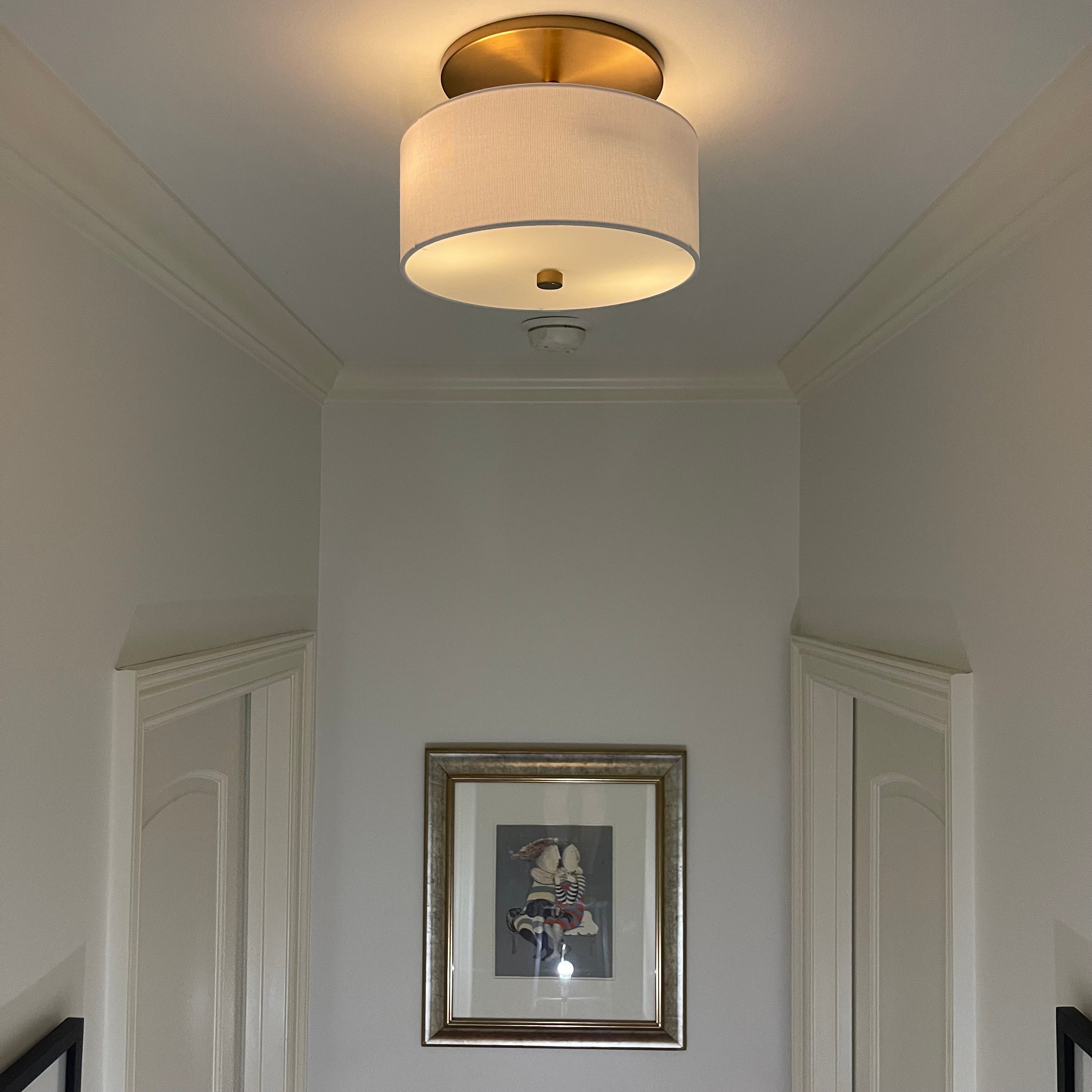 Satin Brass with White Linen Shade Instant Flush Mount Conversion Kit installed in hallway
