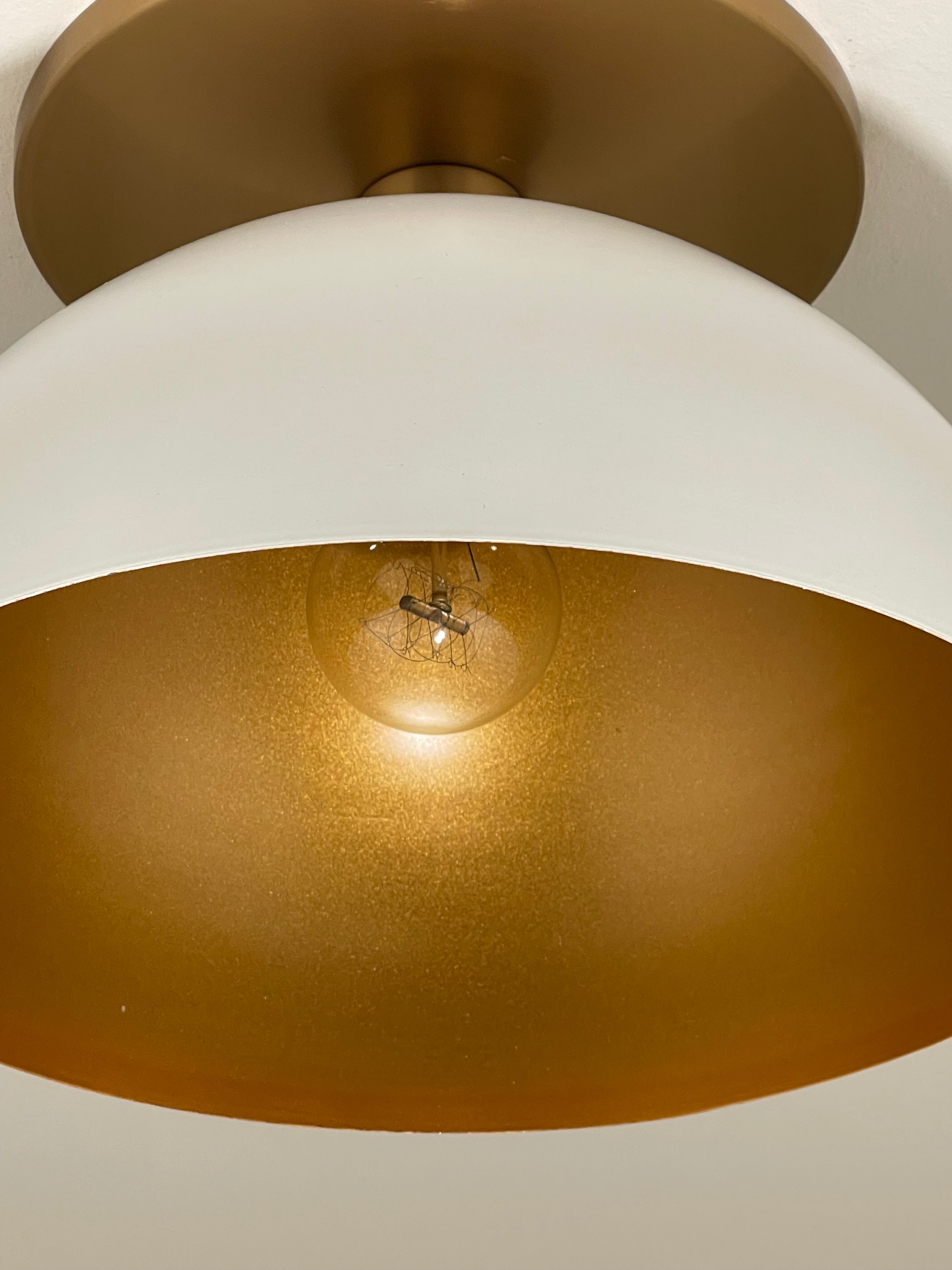 Closeup of Gold and White Metal Dome Light