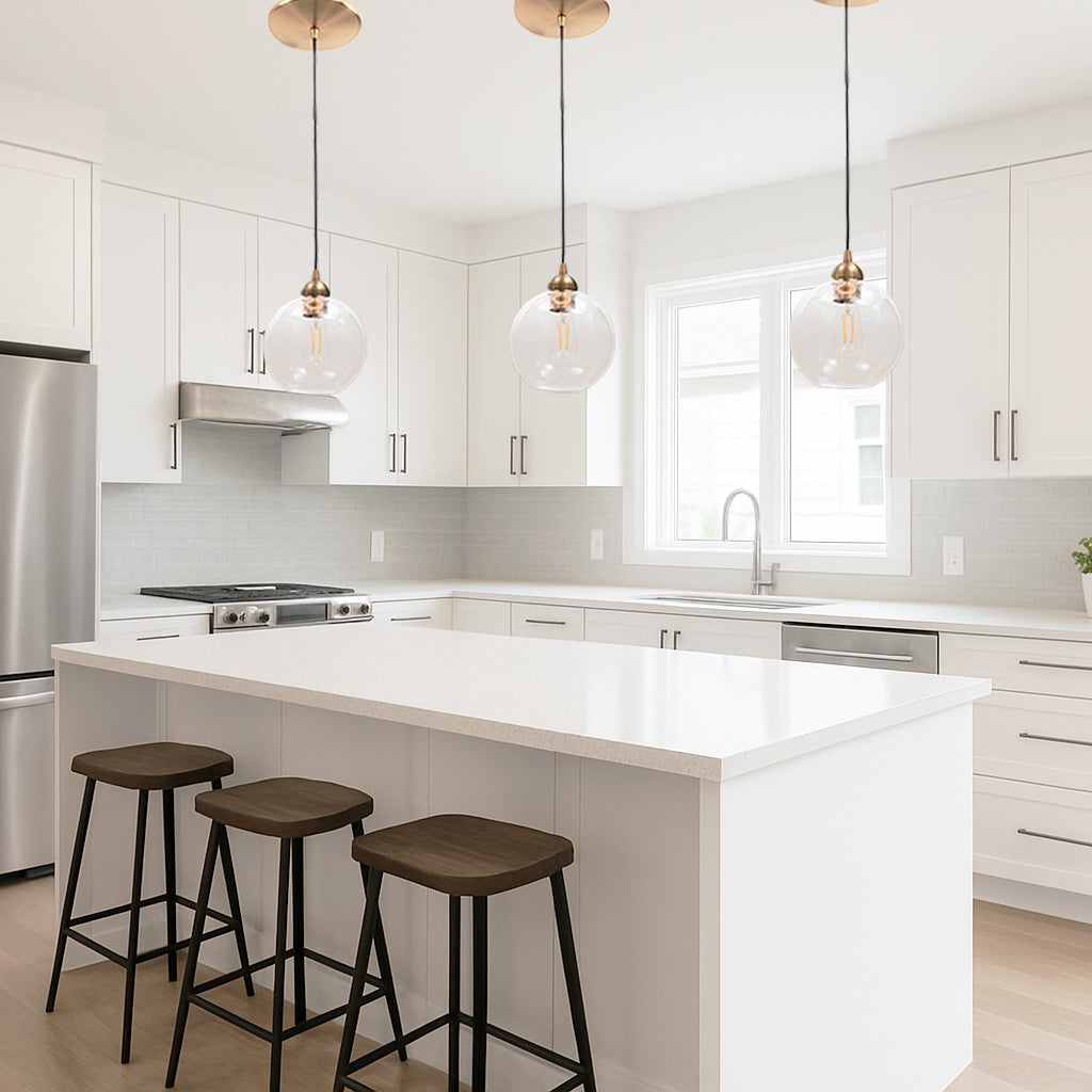3 Satin Brass Clear Globe Instant Pendant installed over a kitchen counter