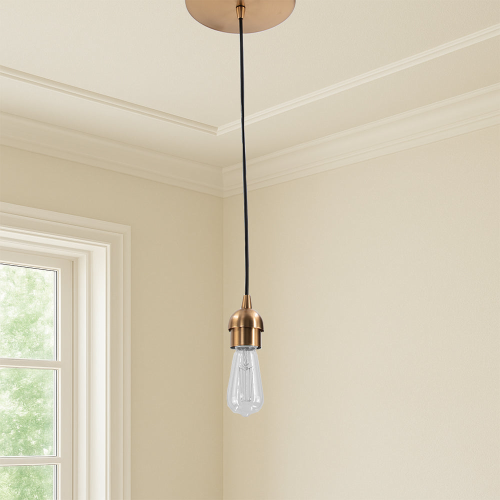 Satin Brass Instant Pendant Light installed in the corner of a room