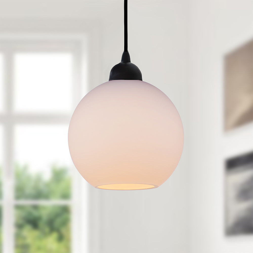 Matte Black Milk Globe Instant Pendant closeup of shade with light turned on