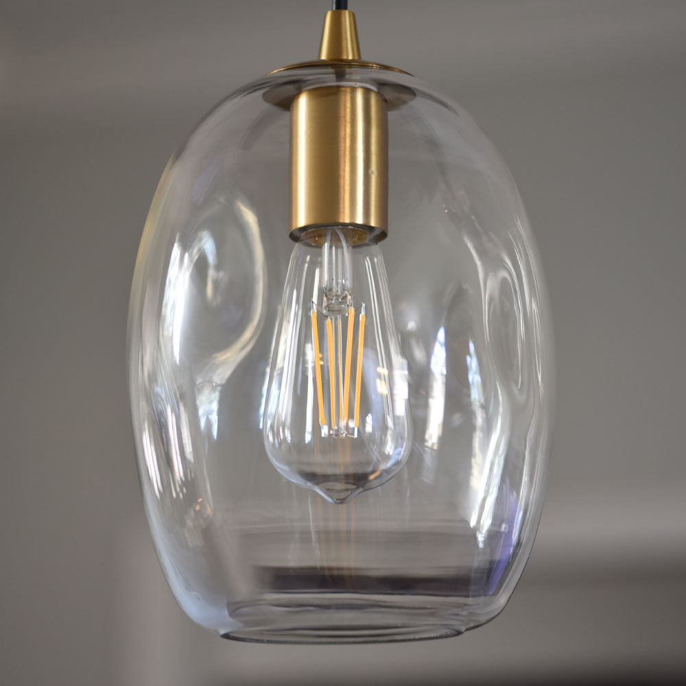 Closeup of shade of the Artisan Dimpled Clear Glass Instant Pendant Light