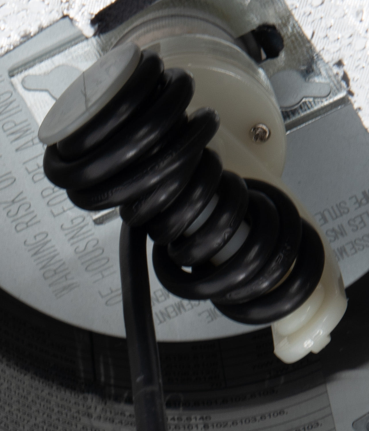 Shot of inside recessed can with wrapped cord