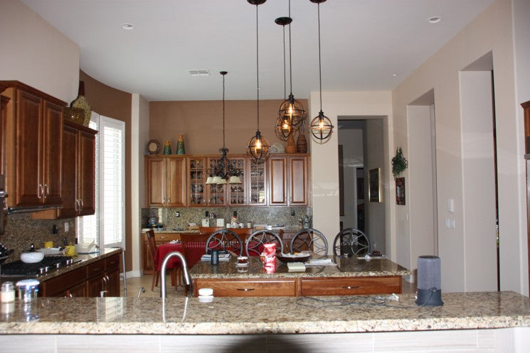 Photo from customer on 5 star review Brushed Bronze 10" Globe Instant Pendant installed in kitchen